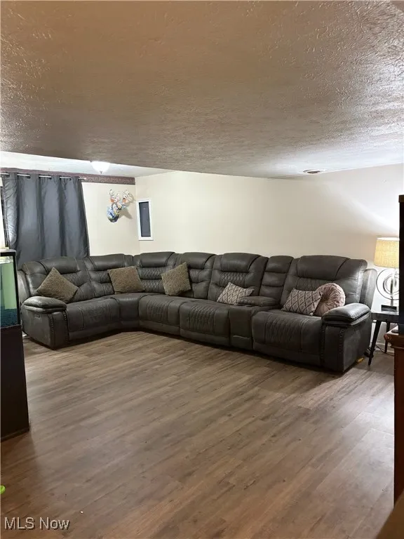 Family Room with LTV finished floors and a textured ceiling