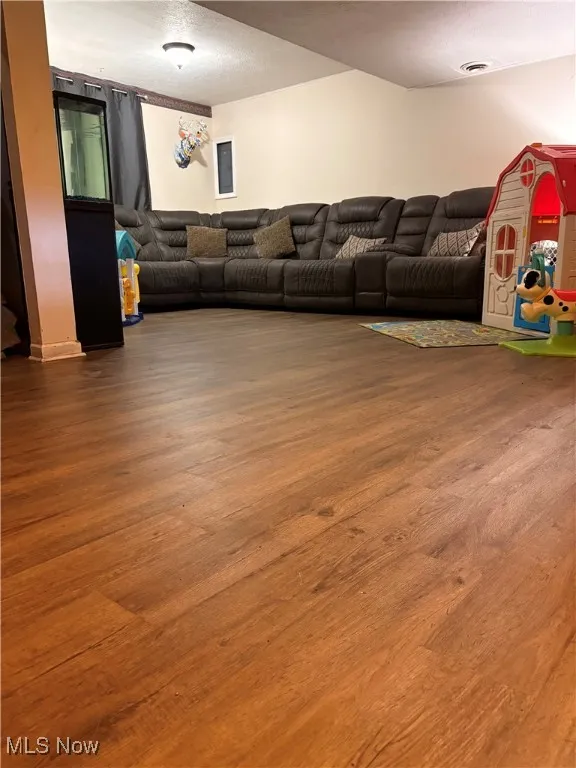 Family Room featuring visible vents and wood finished floors