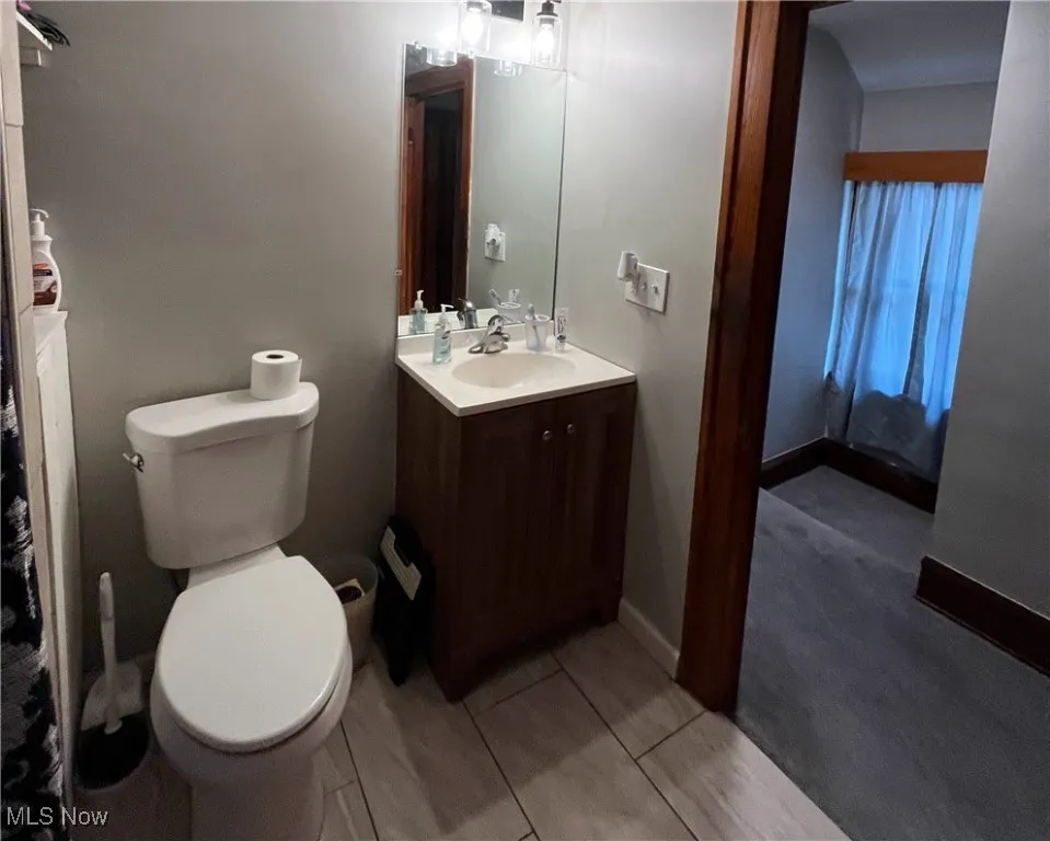 Bathroom featuring toilet and vanity