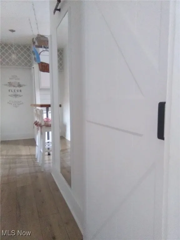 Hallway featuring wood finished floors