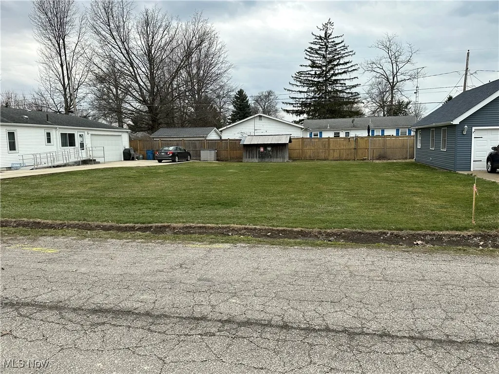 View of yard featuring fence