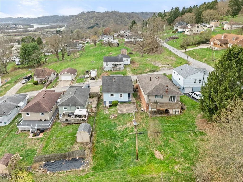 Birds eye view of property with a residential view