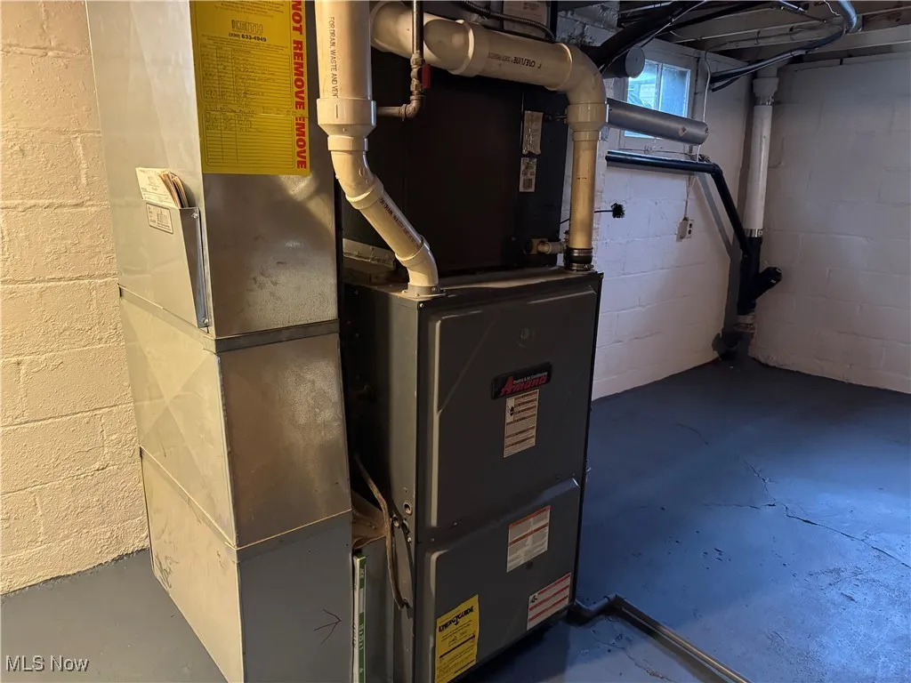 Utility room featuring heating unit