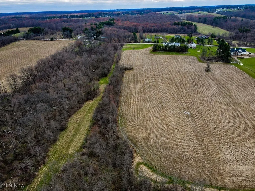 Birds eye view of property featuring a rural view