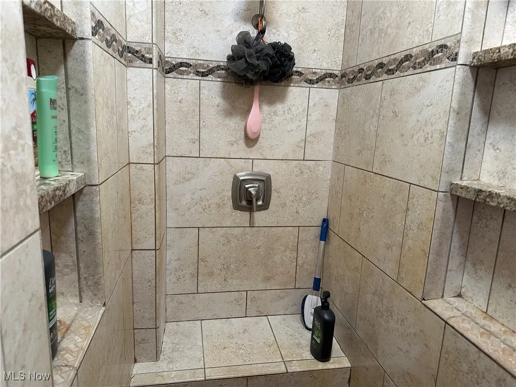 Details featuring tiled shower