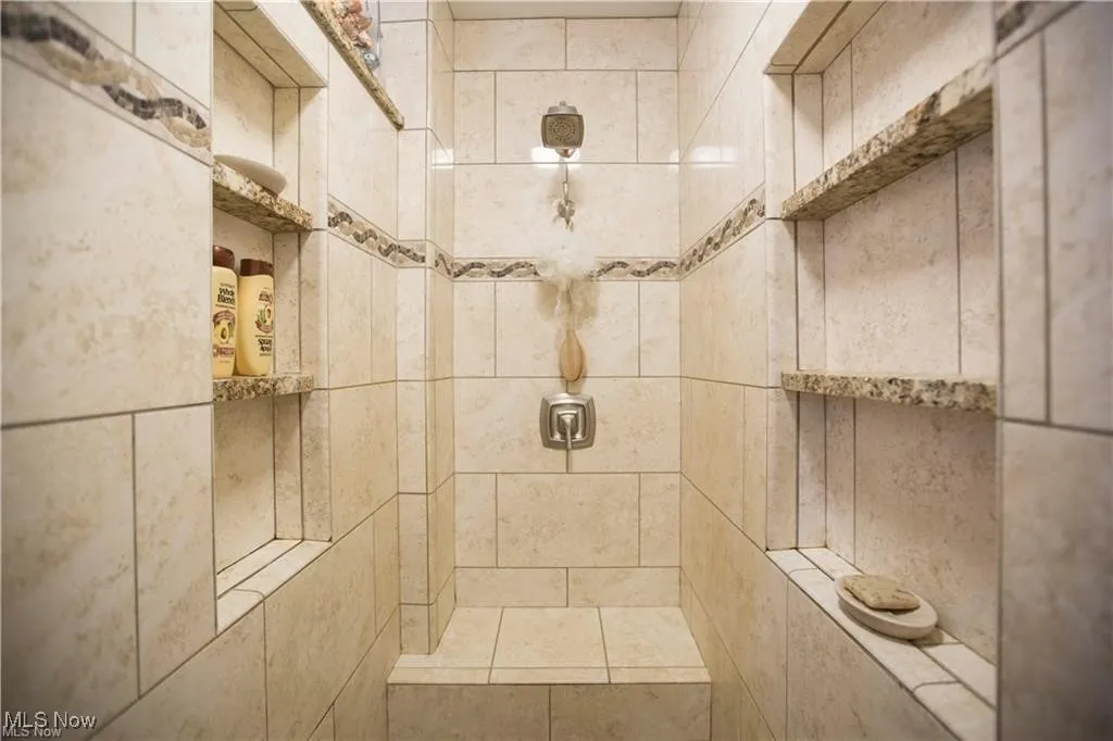 Bathroom with a tile shower