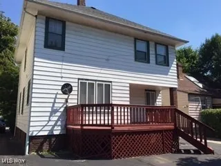Rear view of house with a chimney
