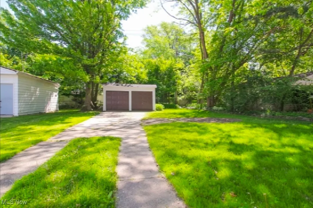 View of yard with a detached garage