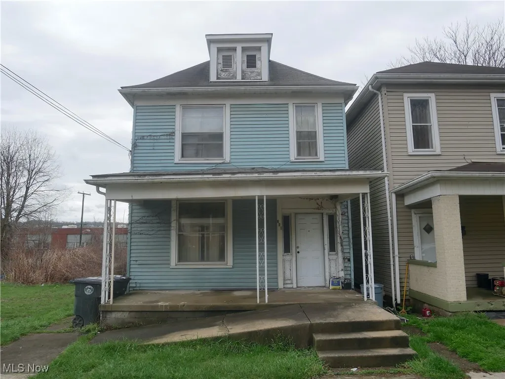 Traditional style home featuring a porch
