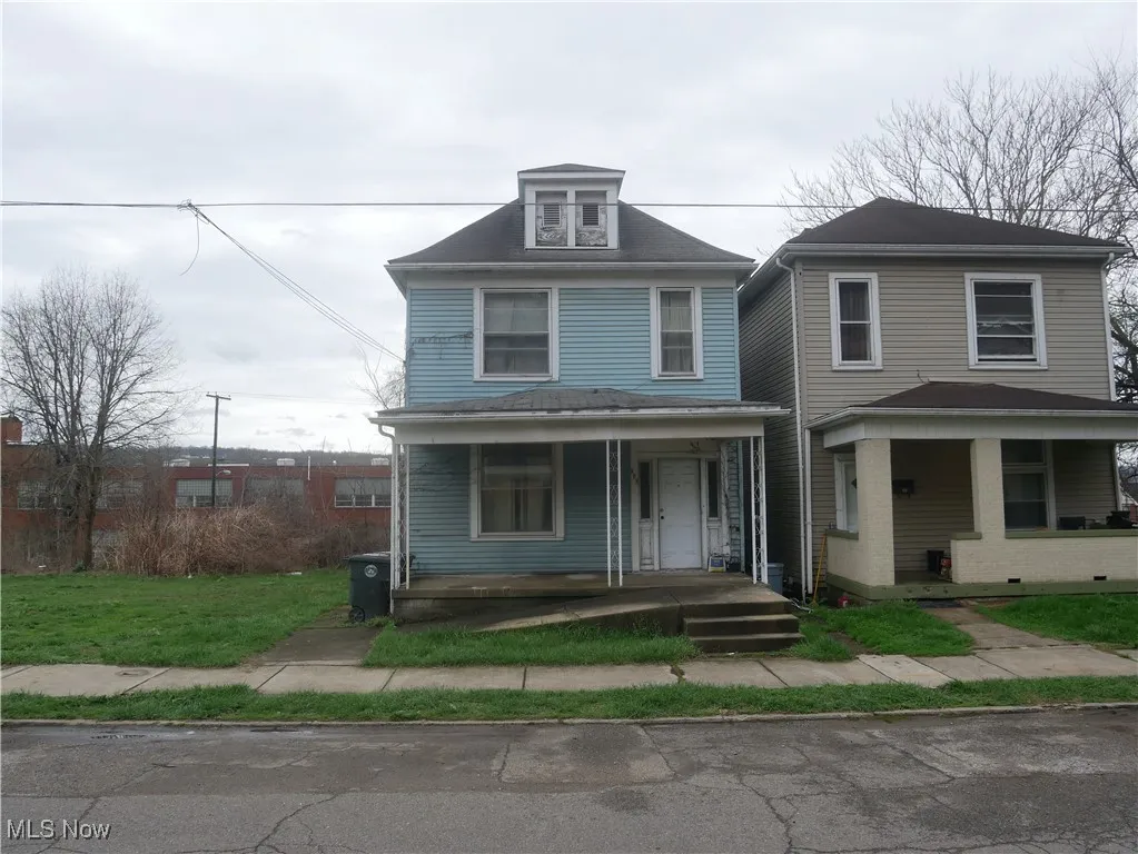 Traditional style home with covered porch