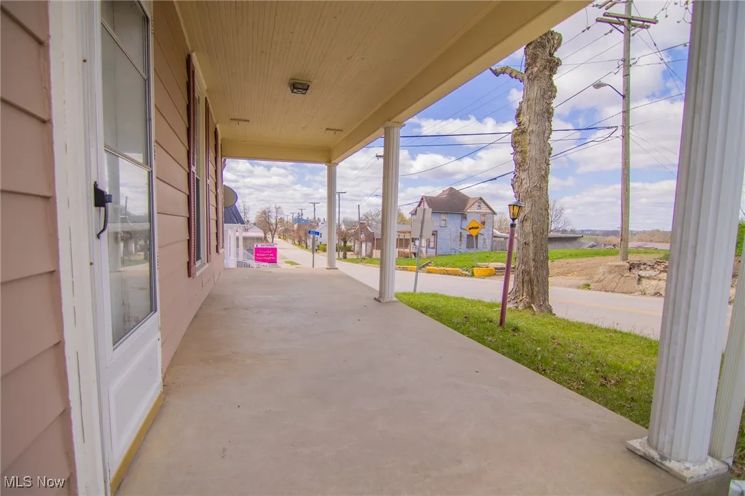 View of patio featuring a porch and a residential view