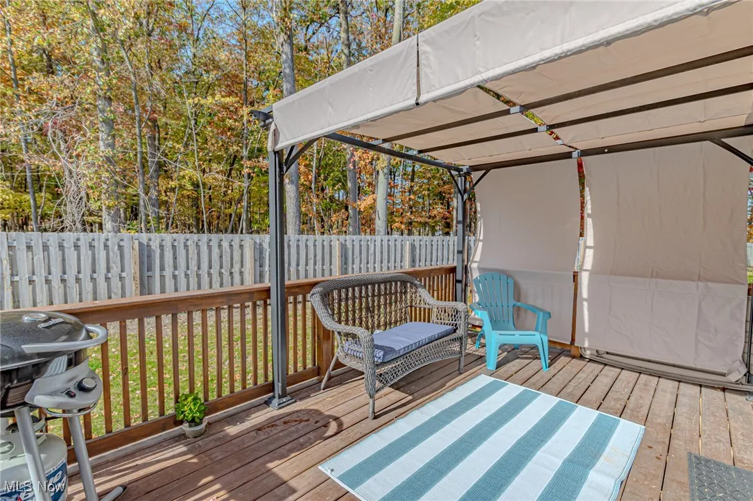 Deck with a grill and fence
