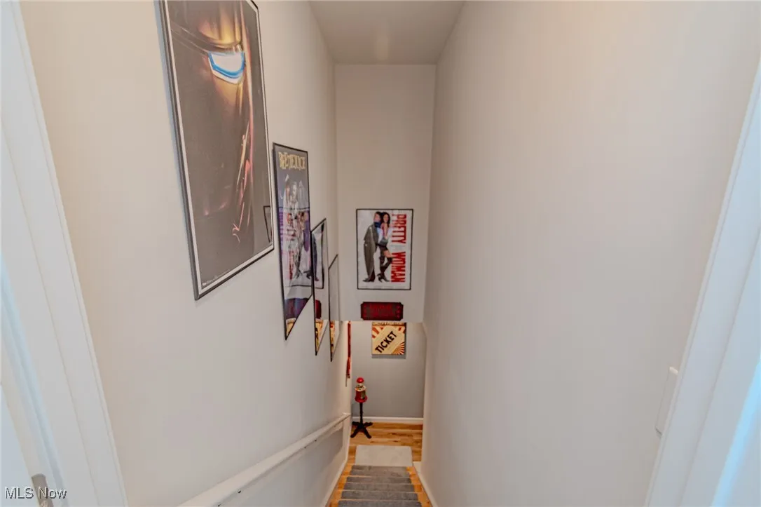 Hallway featuring baseboards and wood finished floors