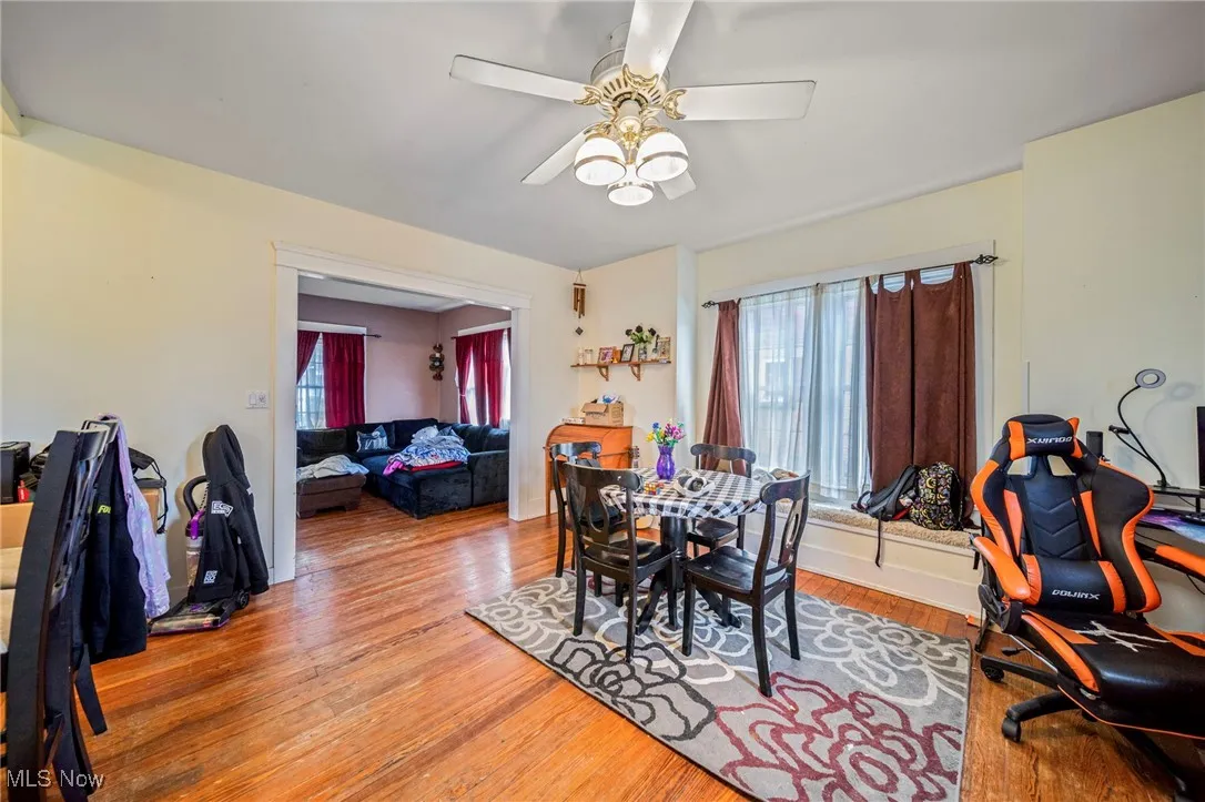 Dining room featuring a ceiling fan and wood finished floors