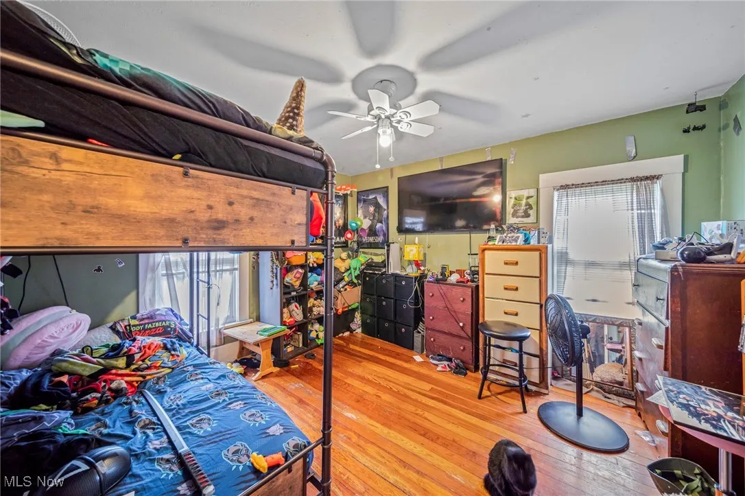 Bedroom with wood-type flooring