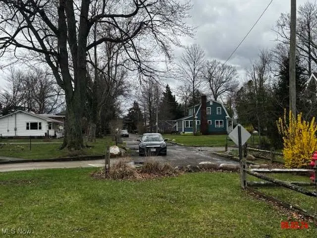 View of yard featuring fence