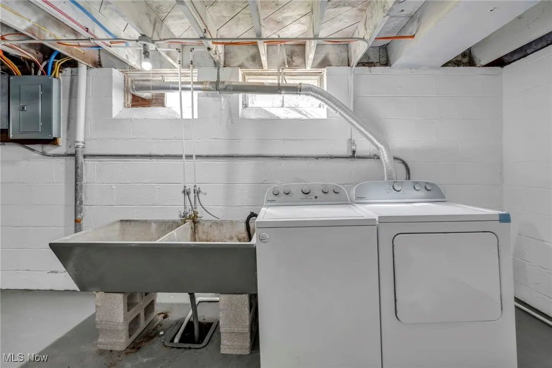 Laundry area with independent washer and dryer, laundry area, and electric panel