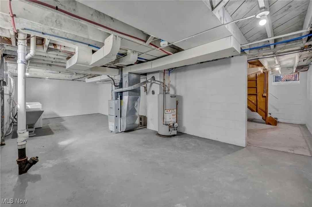 Basement with water heater and heating unit