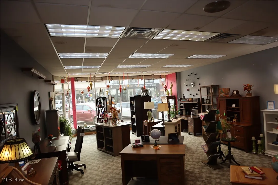 Miscellaneous room featuring visible vents, a drop ceiling, and carpet floors