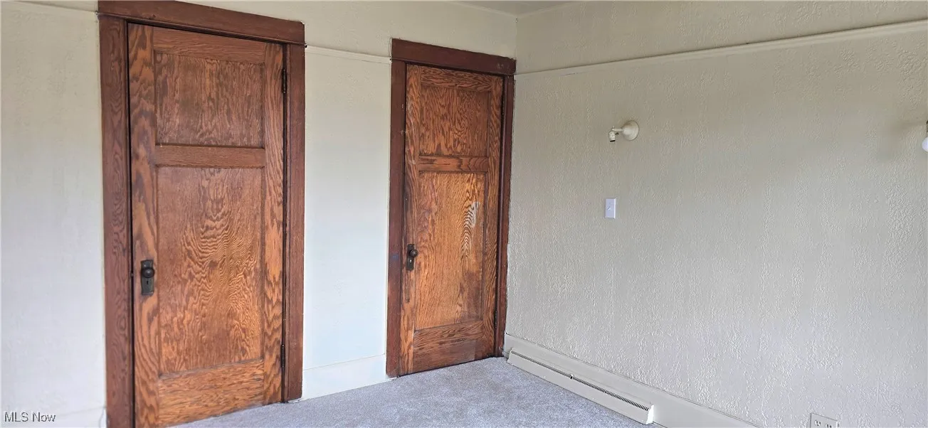 Unfurnished bedroom featuring carpet flooring