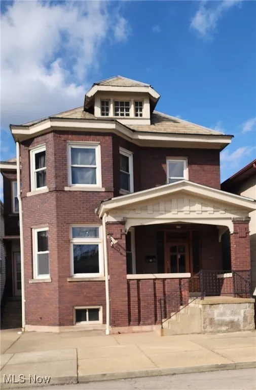 View of front of property featuring covered porch