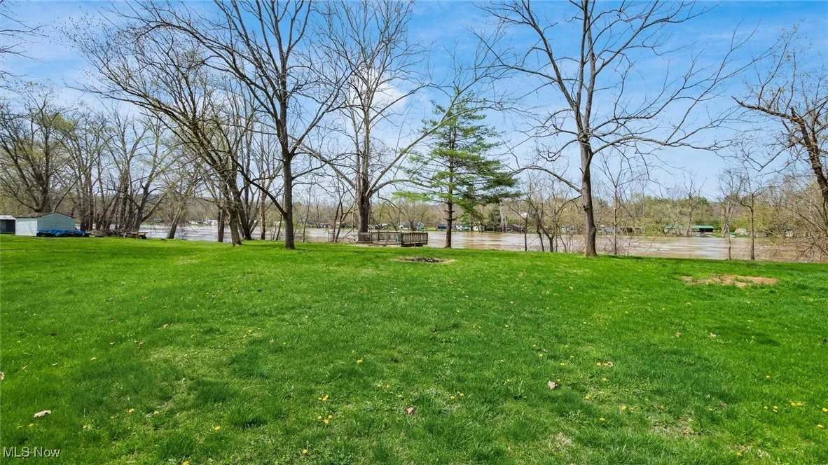 View of yard with a water view