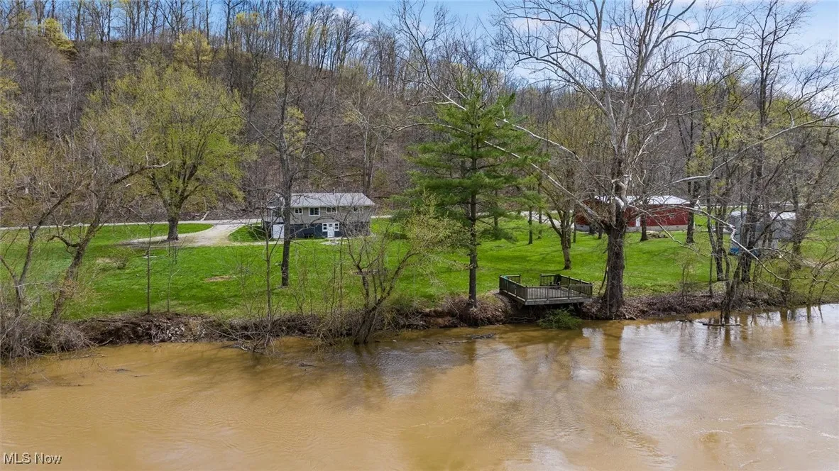 Property view of water with a forest view
