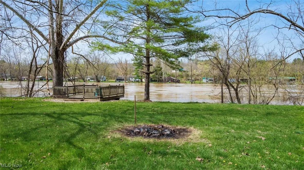 View of yard with a water view