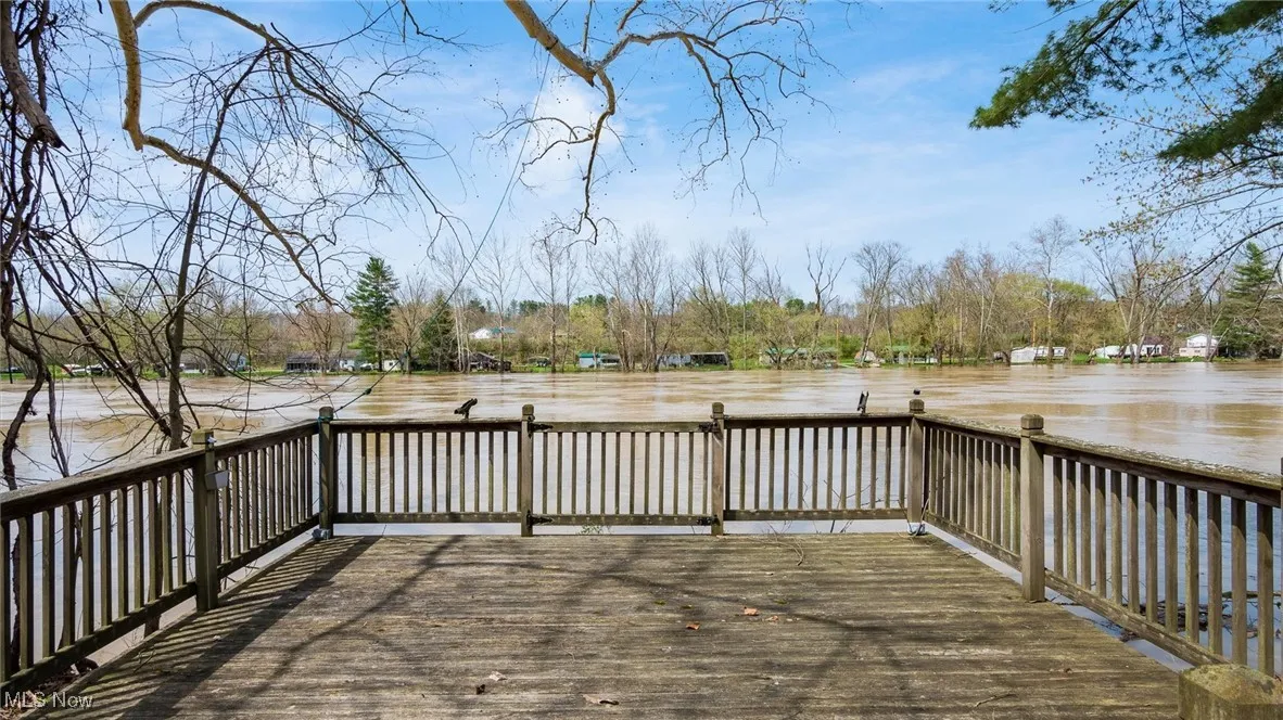 Wooden terrace featuring a water view