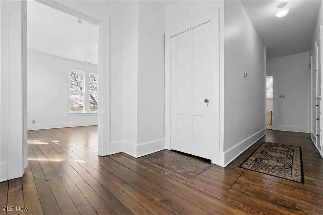 2nd level showing view into bedroom and door leading to the attic