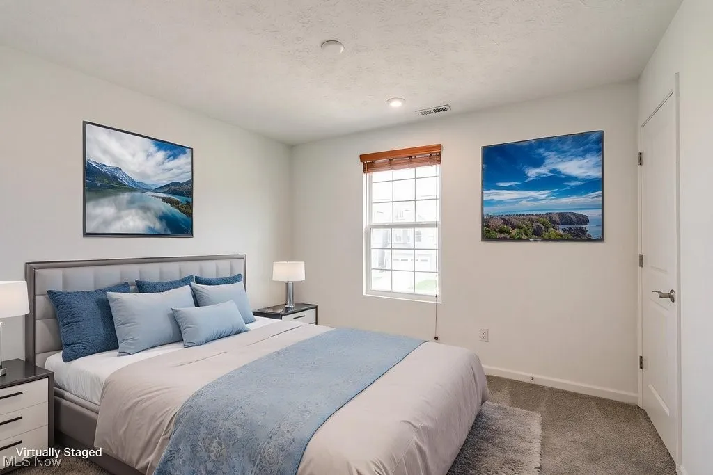 The second bedroom offers a private retreat, filled with natural light and featuring a spacious walk-in closet. It connects to its own private bath, adding both comfort and convenience to this inviting space.