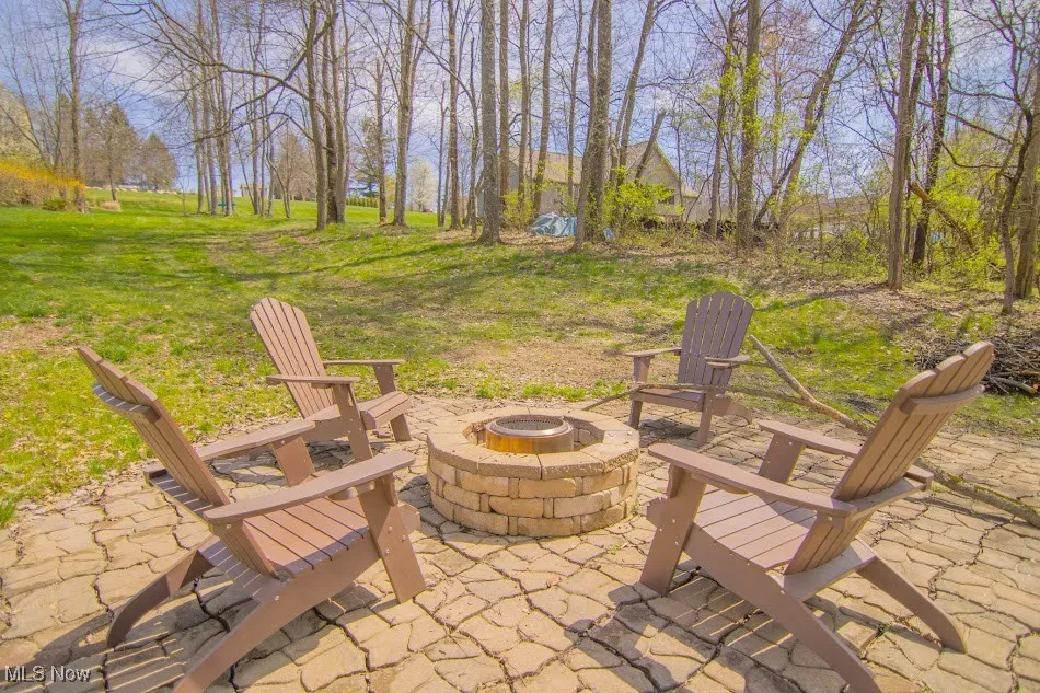 View of patio / terrace featuring an outdoor fire pit