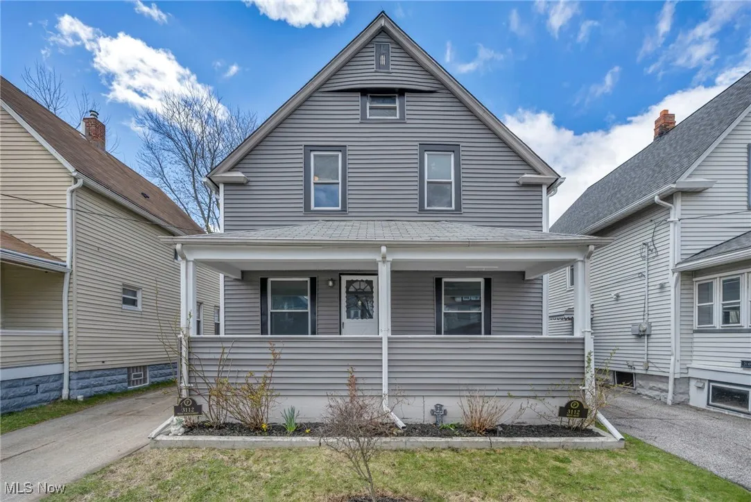 View of front of home featuring a porch and a shingled roof