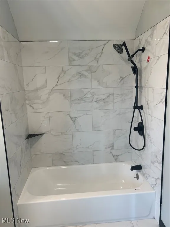Bathroom featuring bathing tub / shower combination