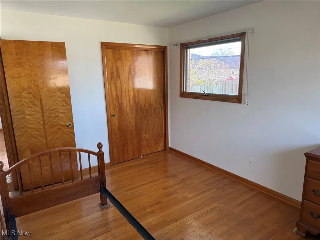 Bedroom featuring a closet and light hardwood / wood-style flooring
