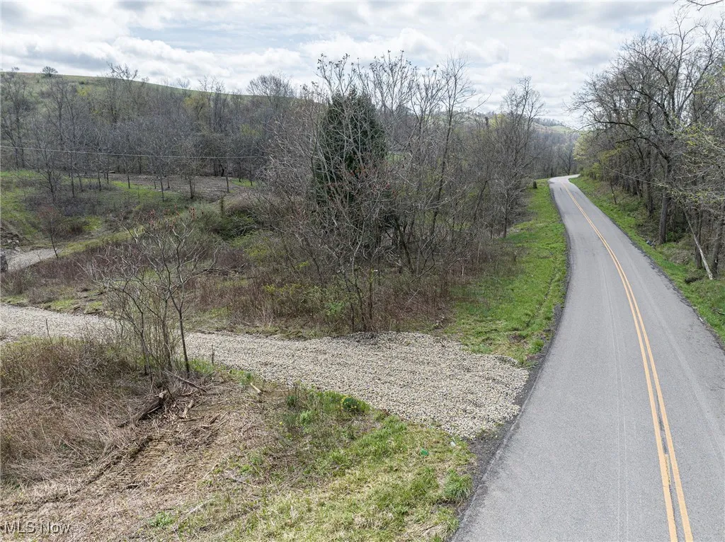 View of street featuring a wooded view