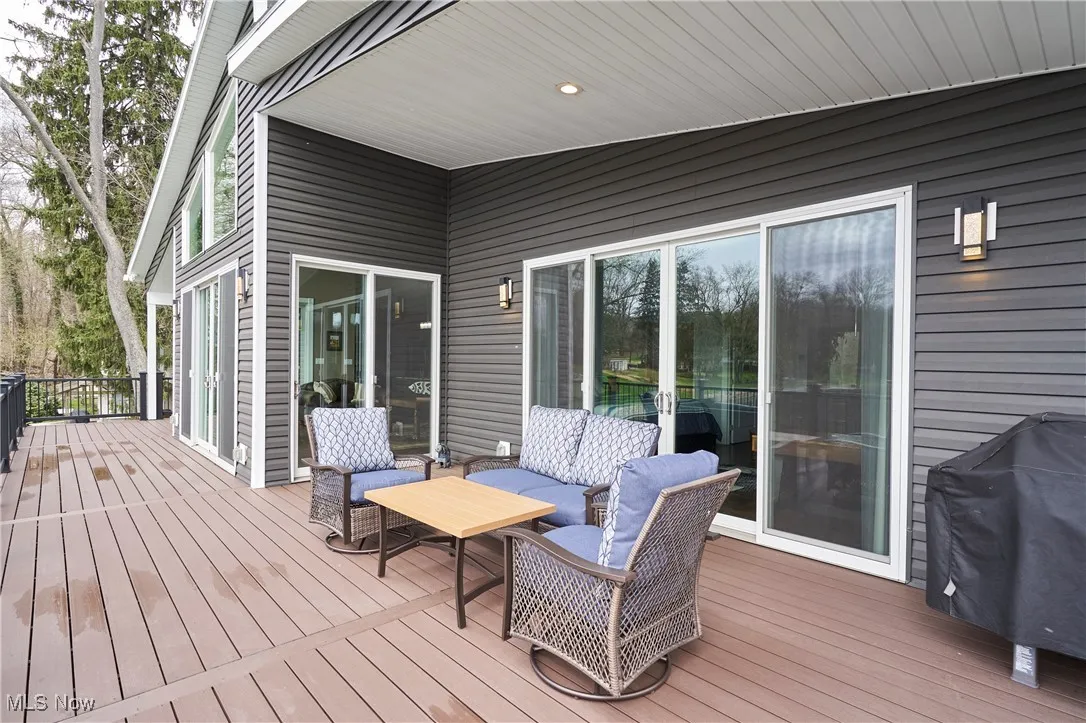 TRX deck Off primary bedroom terrace featuring outdoor lounge area and a grill