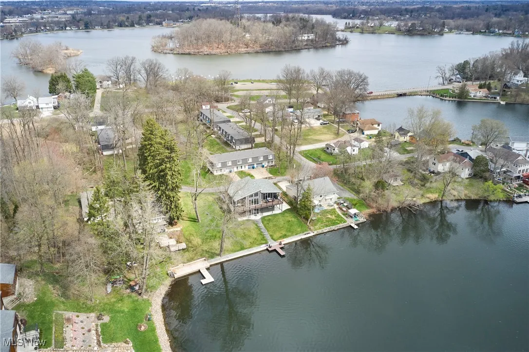 Drone / aerial view featuring a water view and a residential view