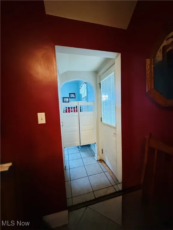 Hall with tile patterned floors