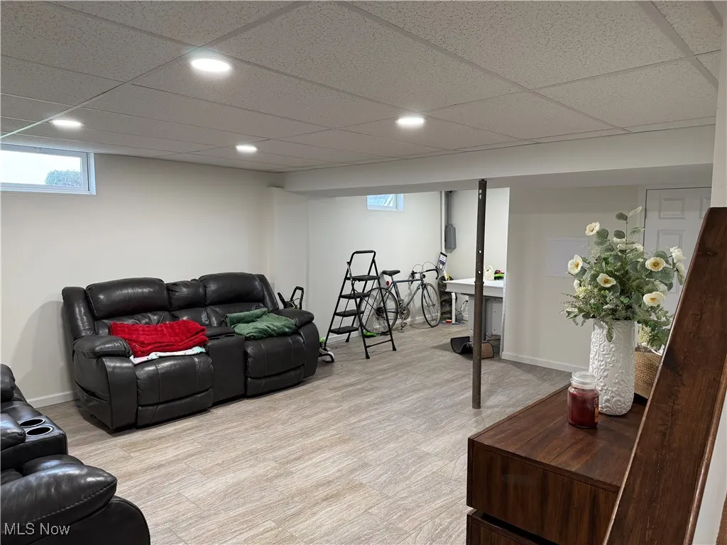 Living area featuring baseboards and recessed lighting