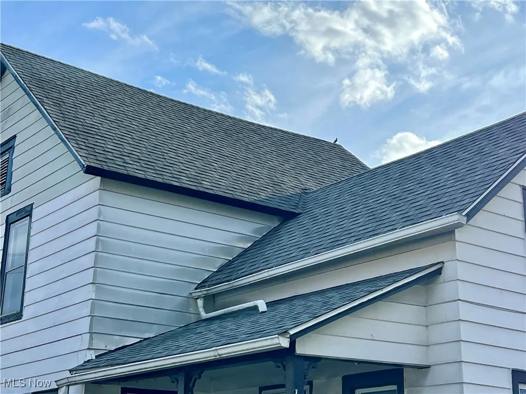Exterior details with roof with shingles