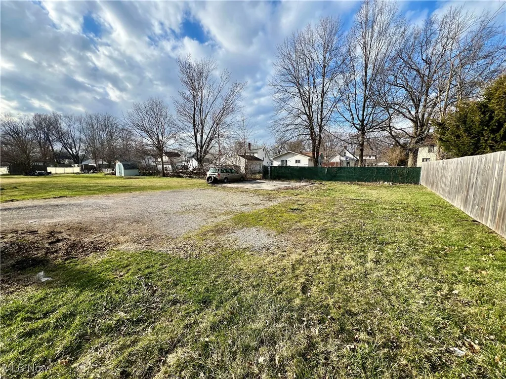 View of yard featuring fence