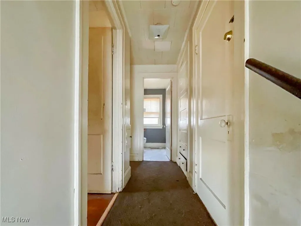 Hall featuring attic access
