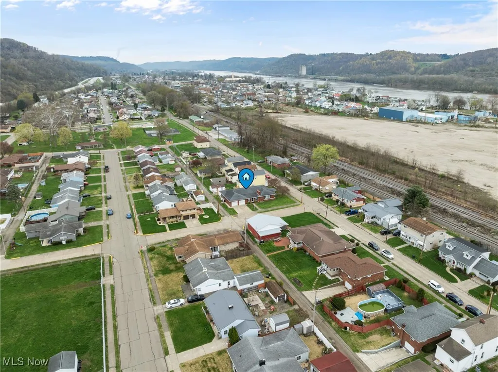 Aerial view featuring a mountain view and a residential view