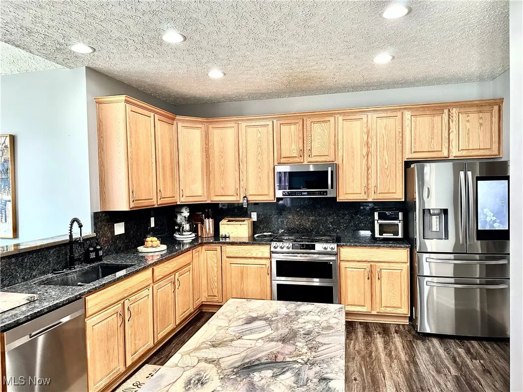 Center angle island with quartzite countertops