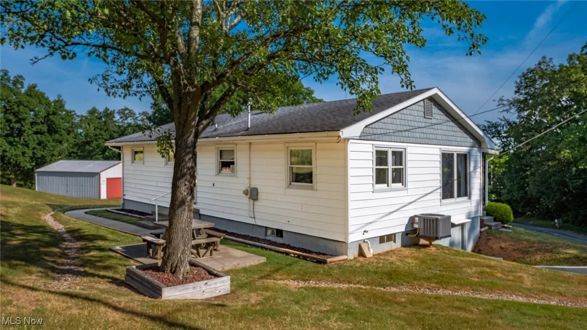 Back of property with a yard