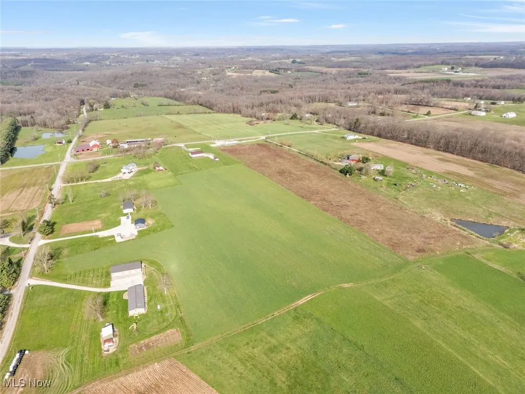 Drone / aerial view featuring a rural view and a water view