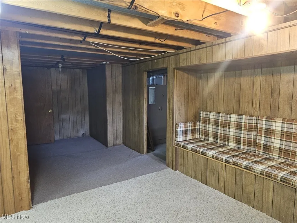 View from rec room to bedroom on left and utility room to right
