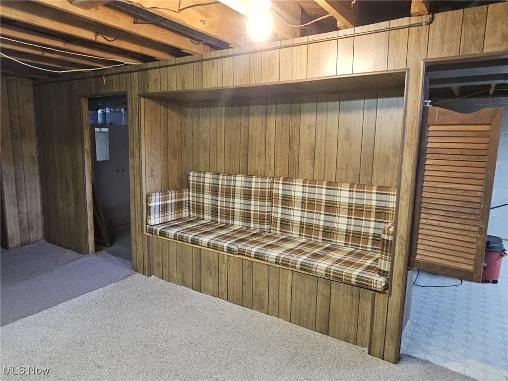 Quaint sitting area showing entrance to laundry and utility room