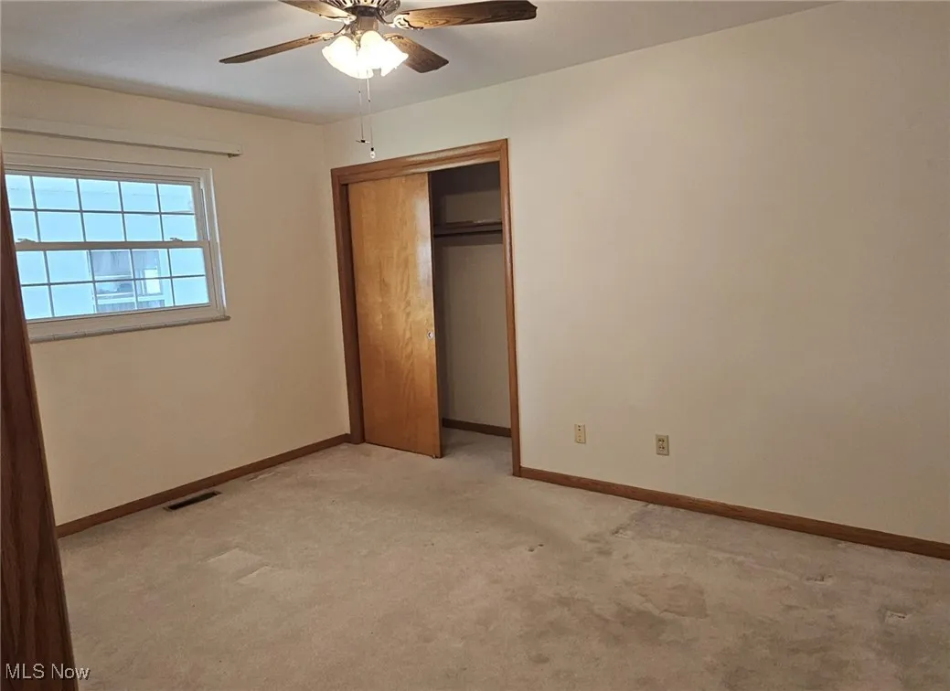 Single story home with an attached garage, concrete driveway, and a shingled roof